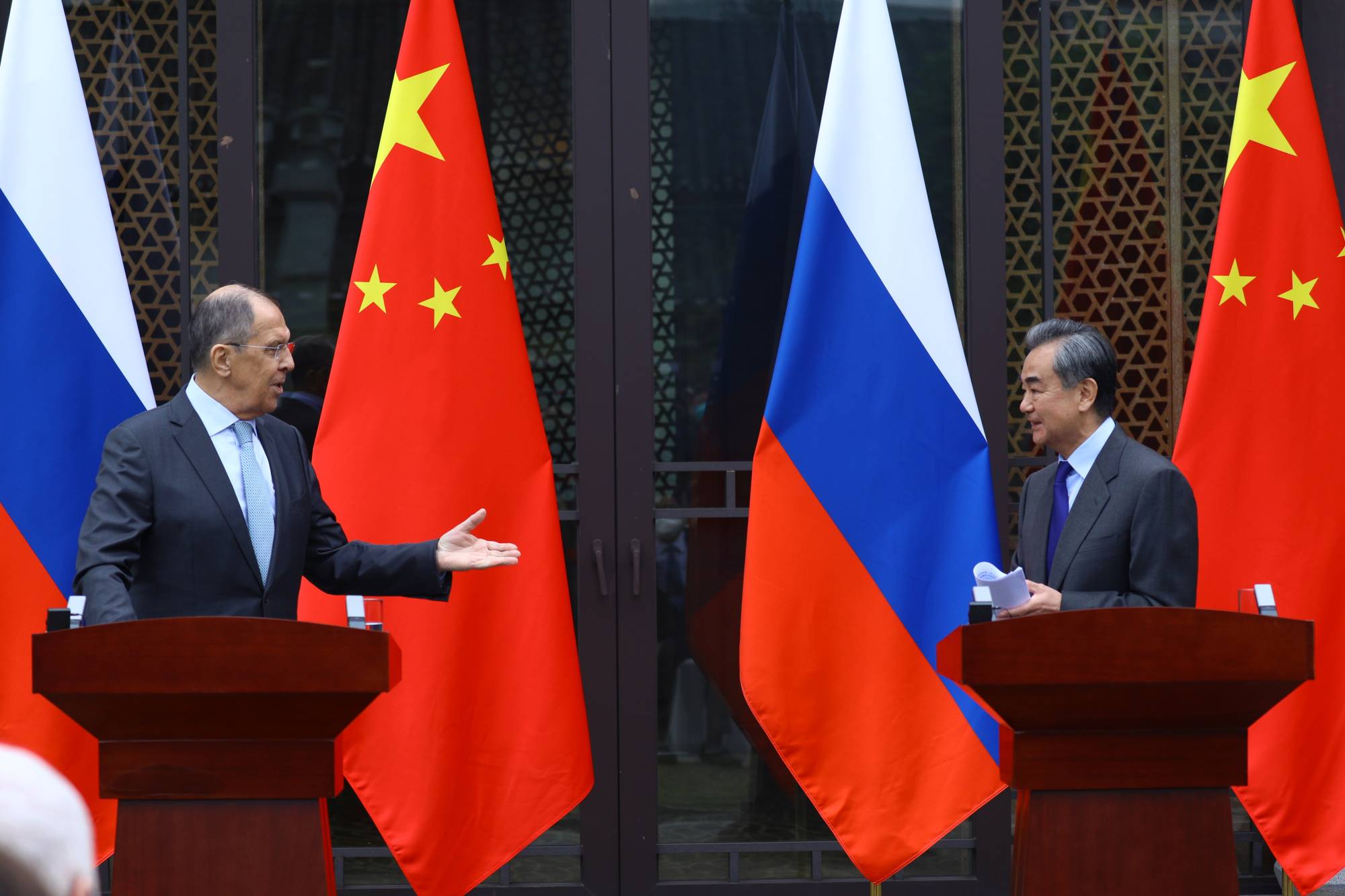 Russian Foreign Minister Sergey Lavrov and Chinese State Councilor Wang Yi attend a news conference following their meeting in Guilin, China, on March 23. | Russian Foreign Ministry / via REUTERS 