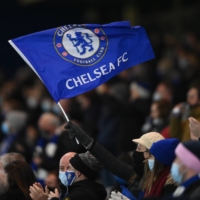 Chelsea fans cheer before a match against Leeds United at Stamford Bridge in London on Dec. 5, 2020. | REUTERS