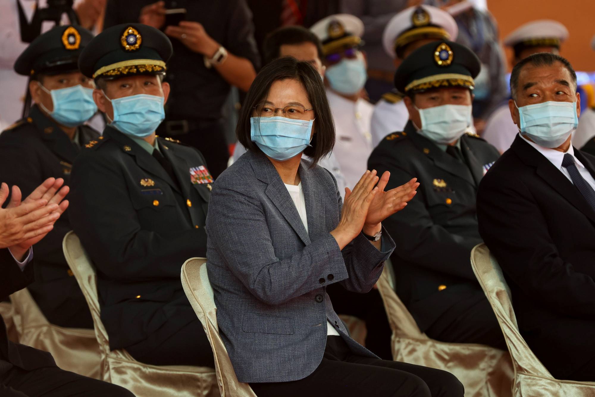 Taiwan President Tsai Ing-wen applauds during the launch ceremony for the Taiwanese Navy's domestically built amphibious transport dock Yushan in Kaohsiung on April 13. | REUTERS