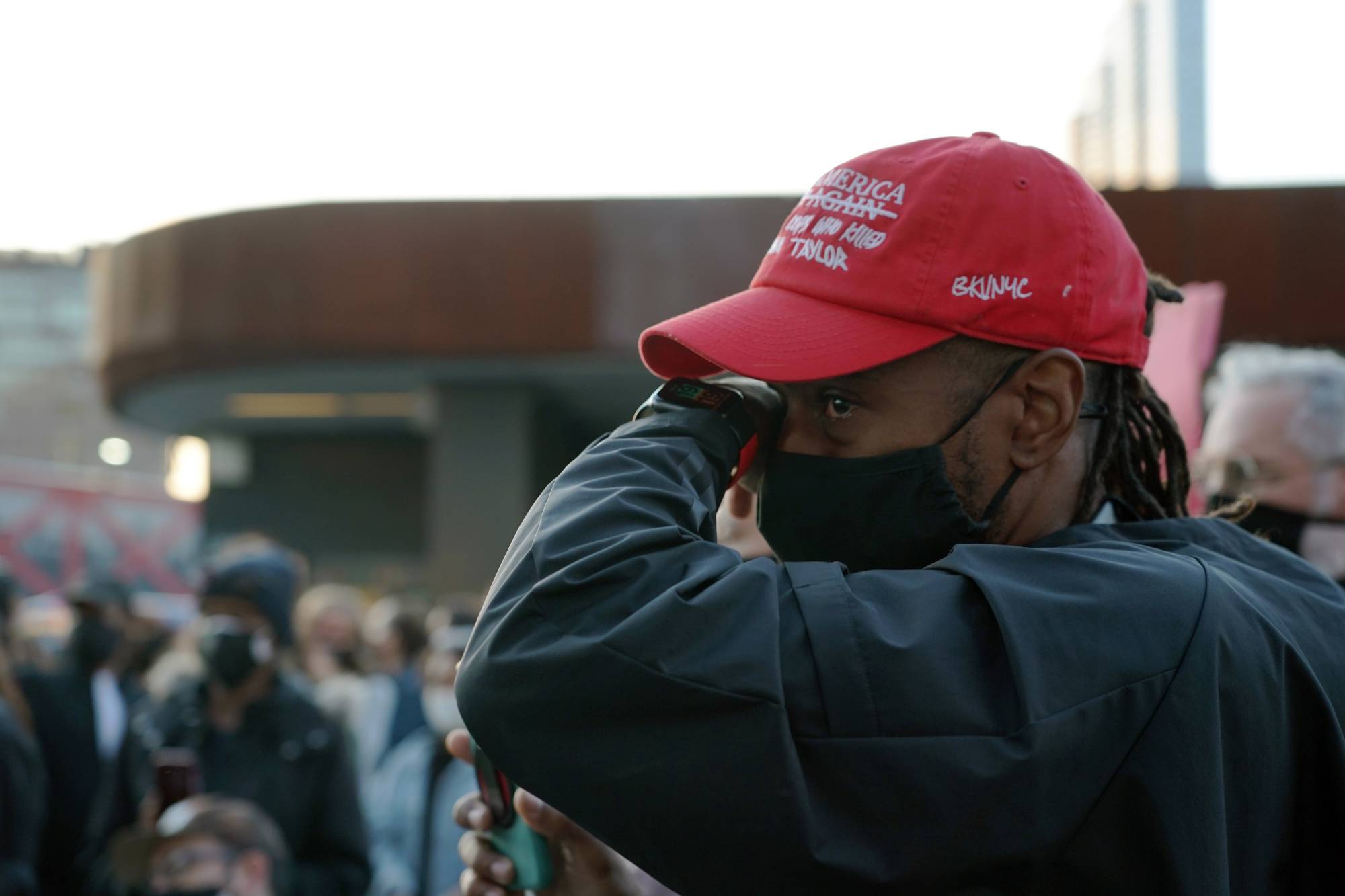 People gather outside the Barclays Center in Brooklyn, New York, on Tuesday to celebrate the guilty verdict in the George Floyd case. | Michelle V. Agins / The New York Times