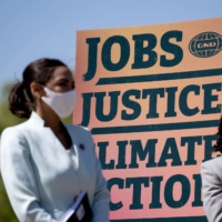 U.S. Rep. Alexandria Ocasio-Cortez (left) during a news conference in Washington Tuesday that reintroduced the Green New Deal to fight climate change.  | BLOOMBERG