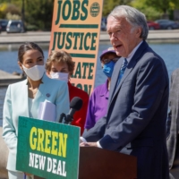 U.S. Rep. Alexandria Ocasio-Cortez and Sen. Ed Markey lead a news conference to reintroduce the Green New Deal at the U.S. Capitol in Washington on Tuesday.  | REUTERS 