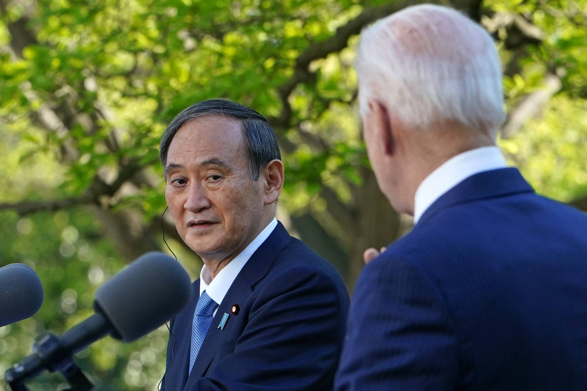 Prime Minister Yoshihide Suga and U.S. President Joe Biden take part in a joint press conference at the White House in Washington on April 16. |  AFP-JIIJI