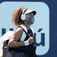 Naomi Osaka walks onto the court before her match against Maria Sakkari during the Miami Open on March 31. | USA TODAY / VIA REUTERS