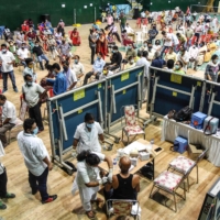 A COVID-19 vaccination site at an indoor stadium in Guwahati, India, on Thursday  | AFP-JIJI