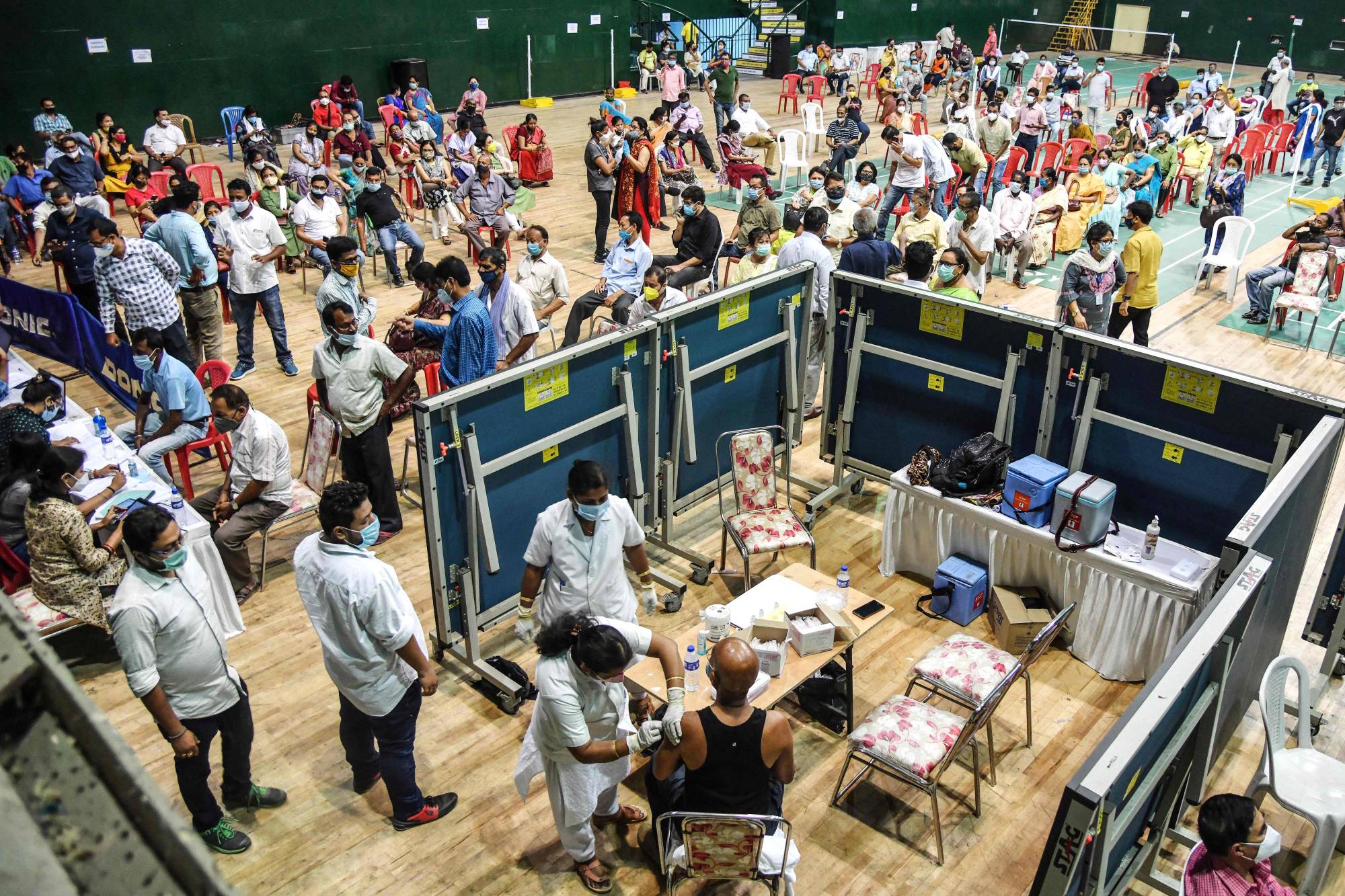 A COVID-19 vaccination site at an indoor stadium in Guwahati, India, on Thursday | AFP-Jiji