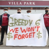 Fans display a banner reacting to the collapse of the European Super League prior to a match between Aston Villa and Manchester City at Villa Park in Birmingham, England, on Wednesday. | AFP-JIJI