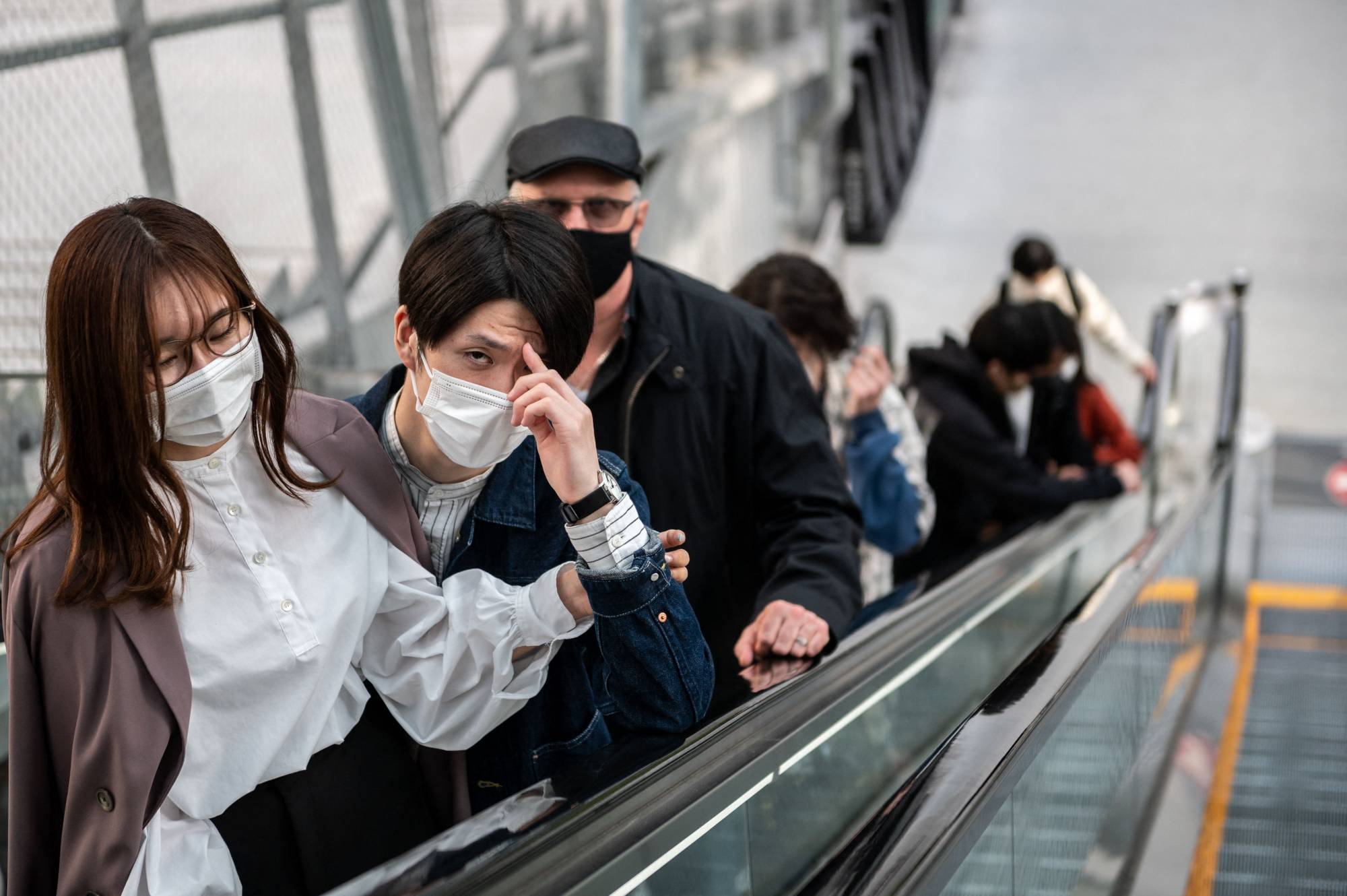 People visit a shopping mall in Tokyo on Saturday, a day before a new coronavirus state of emergency covering Tokyo, Osaka, Kyoto and Hyogo prefectures went into effect. | AFP-JIJI