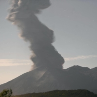 Ash rises from Sakurajima on Sunday morning. | KYODO