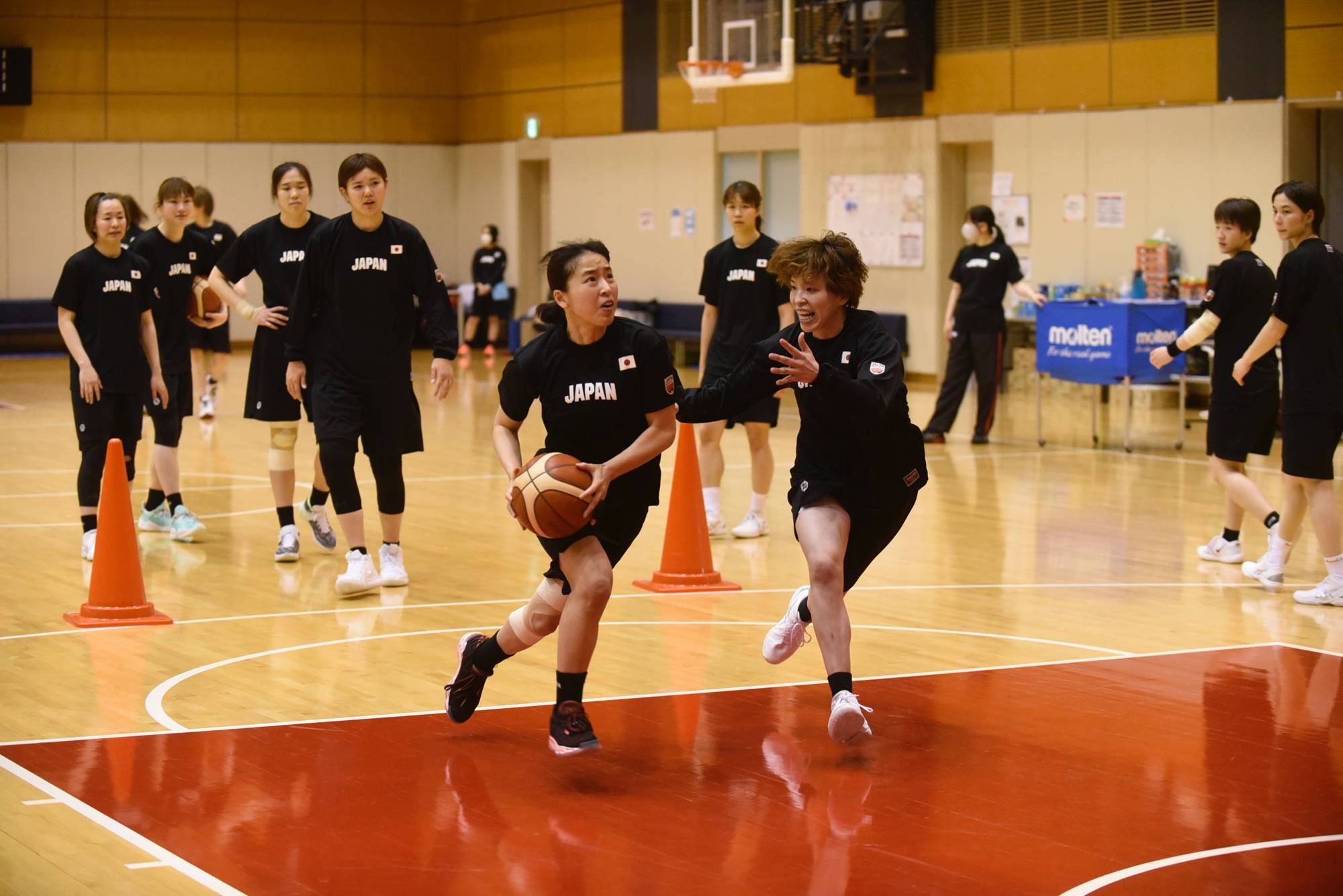 Naho Miyoshi (left) attacks the basket during a practice session on Thursday. | COURTESY OF JAPAN BASKETBALL ASSOCIATION