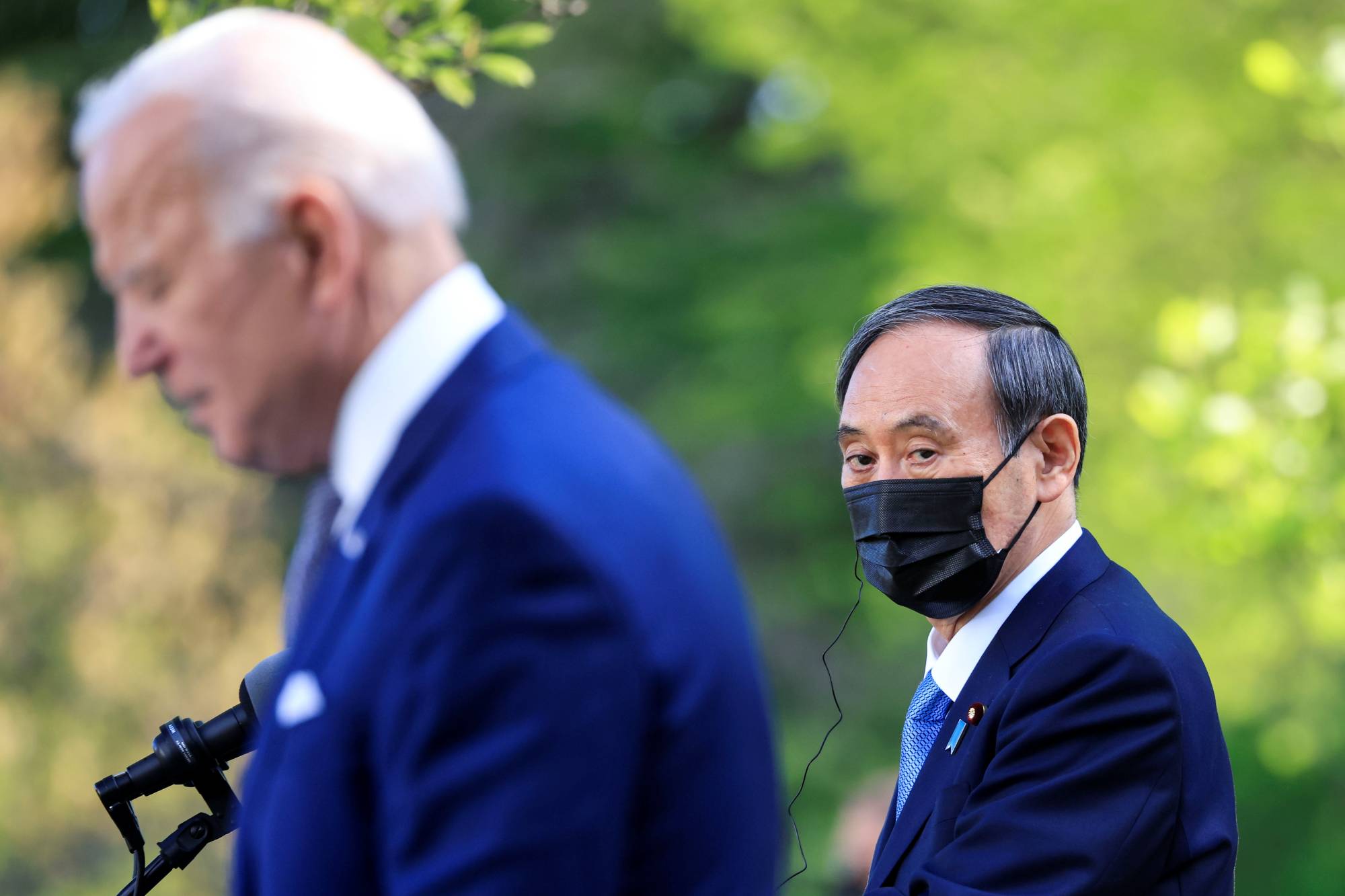 Prime Minister Yoshihide Suga and U.S. President Joe Biden hold a joint news conference at the White House on April 16. | REUTERS