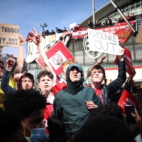 Arsenal fans protest against club owner Stan Kroenke on Friday in London. | REUTERS