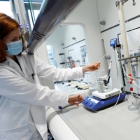 Katharina Gerber, product manager for Vulcan Energy Resources, works on a sample of geothermal water in the town of Eggenstein near Karlsruhe, Germany. | REUTERS 