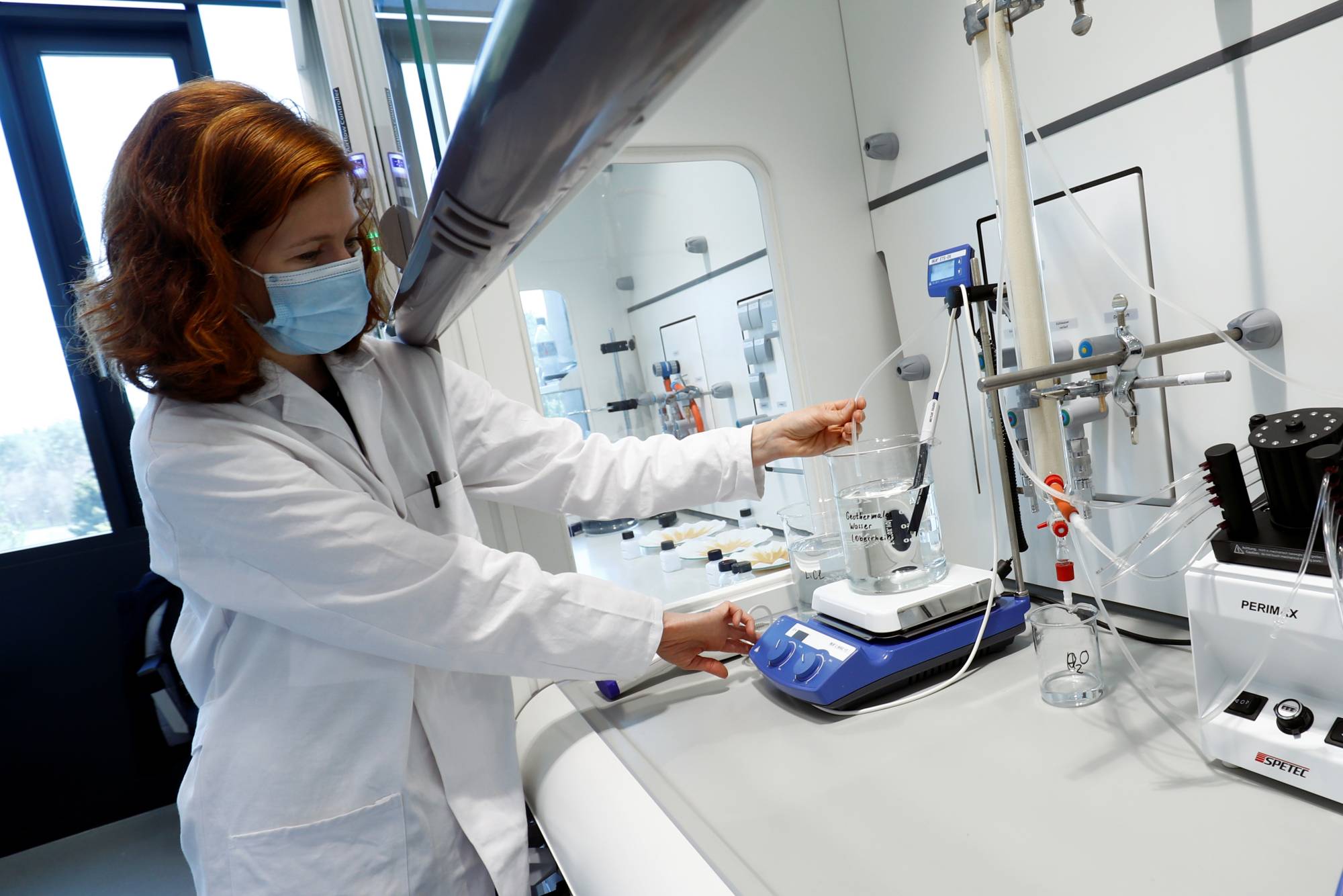 Katharina Gerber, product manager for Vulcan Energy Resources, works on a sample of geothermal water in the town of Eggenstein near Karlsruhe, Germany. | Reuters 