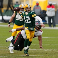 Packers quarterback Aaron Rodgers attempts a pass against the Buccaneers during the NFC title game at Lambeau Field in Green Bay, Wisconsin, on Jan. 24. | USA TODAY / VIA REUTERS