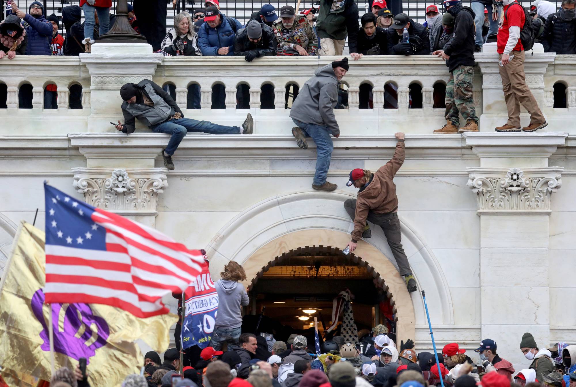 A mob of supporters of former U.S. President Donald Trump storm the U.S. Capitol Building in Washington on Jan. 6. |  REUTERS 