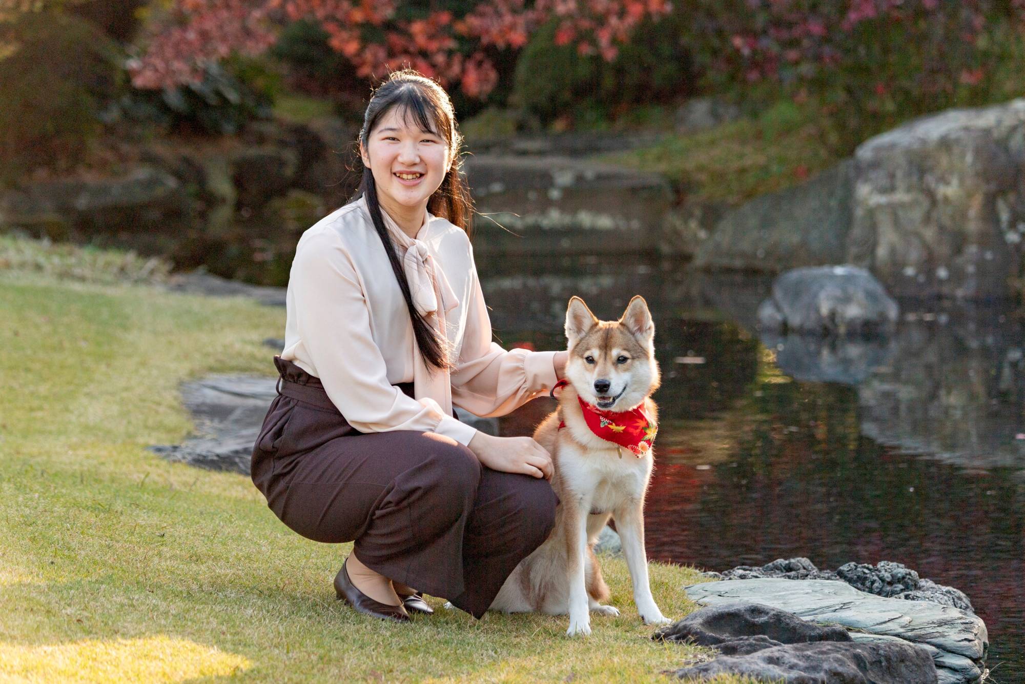 Princess Aiko, daughter of Emperor Naruhito and Empress Masako, with her dog Yuri at the Akasaka residential complex in Tokyo last November | IMPERIAL HOUSEHOLD AGENCY / VIA REUTERS 