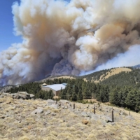 A wildfire burns in New Mexico\'s Lincoln National Forest on April 26. A megadrought deepened by a dearth of monsoon rains in 2020 and disappointing snowfall over the winter are combining this spring to fuel major wildfires months earlier than usual. | USDA FOREST SERVICE / VIA THE NEW YORK TIMES