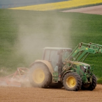 A French farmer driving a tractor on Friday raises a cloud of dust on his field in Gouzeaucourt as drought hits France.  | REUTERS