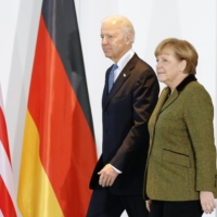 German Chancellor Angela Merkel and Joe Biden, then U.S. vice president, before talks in Berlin in February 2013.  | REUTERS