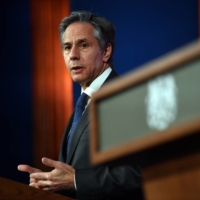 U.S. Secretary of State Antony Blinken speaks at a joint news conference after a bilateral meeting with the U.K.\'s Foreign Secretary Dominic Raab in London on Monday. | POOL / VIA REUTERS