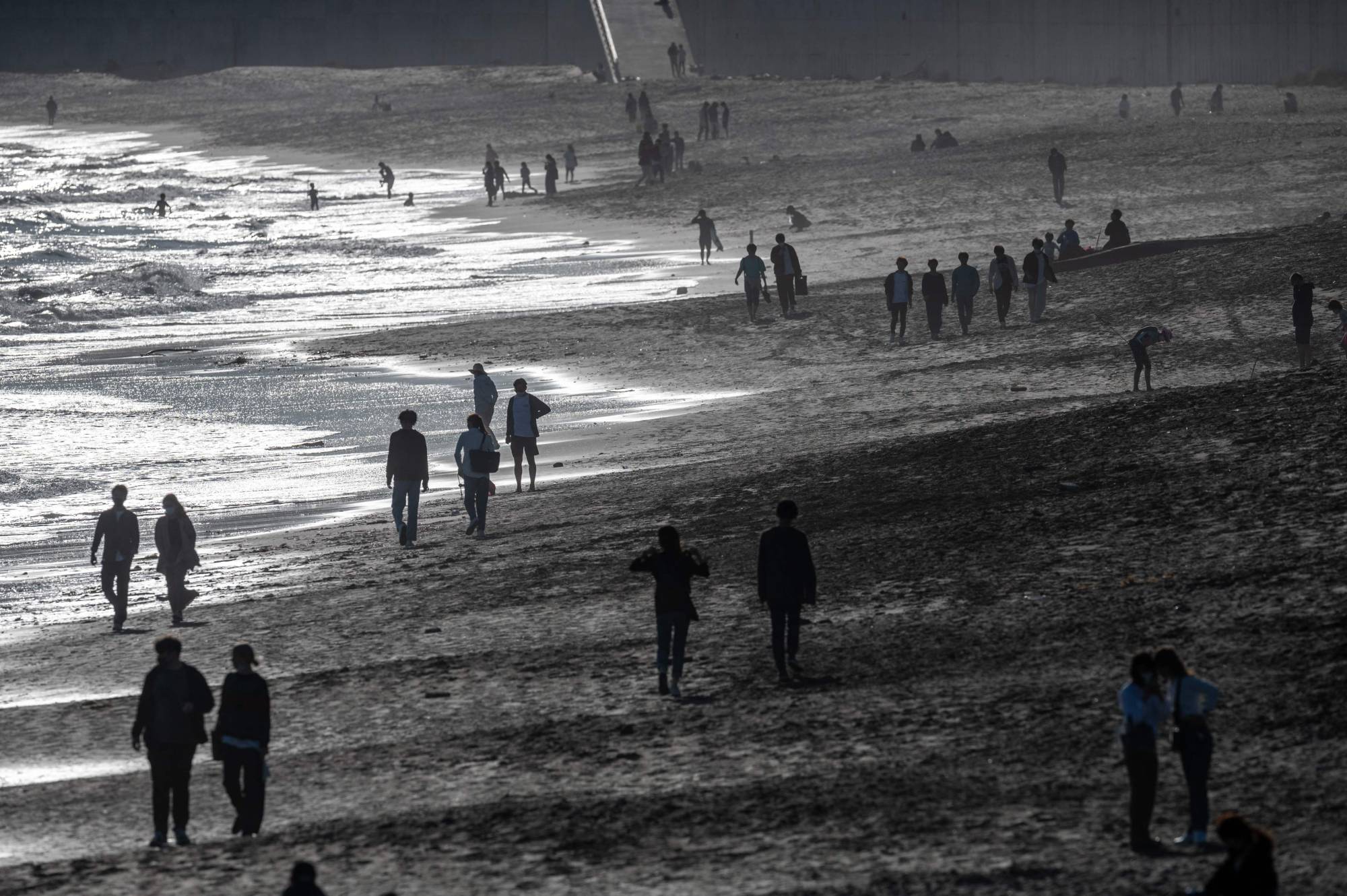 People visit a beach during the Golden Week holidays in Kamakura, Kanagawa Prefecture, on Monday. | AFP-JIJI 