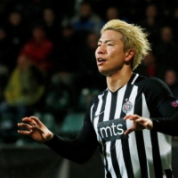 Japan striker Takuma Asano announced Sunday that he had left his club team, Partizan, over unpaid wages. | REUTERS