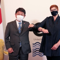 Foreign Minister Toshimitsu Motegi meets with his Australian counterpart, Marise Payne, at the G7 foreign ministers meeting in London on May 5. | POOL / VIA AFP-JIJI