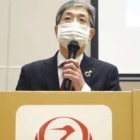 Japan Airlines Co. President Yuji Akasaka speaks at a news conference in Tokyo on Friday. | KYODO