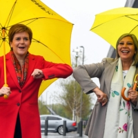 Nicola Sturgeon (left), Scotland\'s first minister and leader of the Scottish National Party, congratulates SNP candidate Kaukab Stewart after she was elected in the Scottish Parliamentary Election in Glasgow on Saturday.  | AFP-JIJI