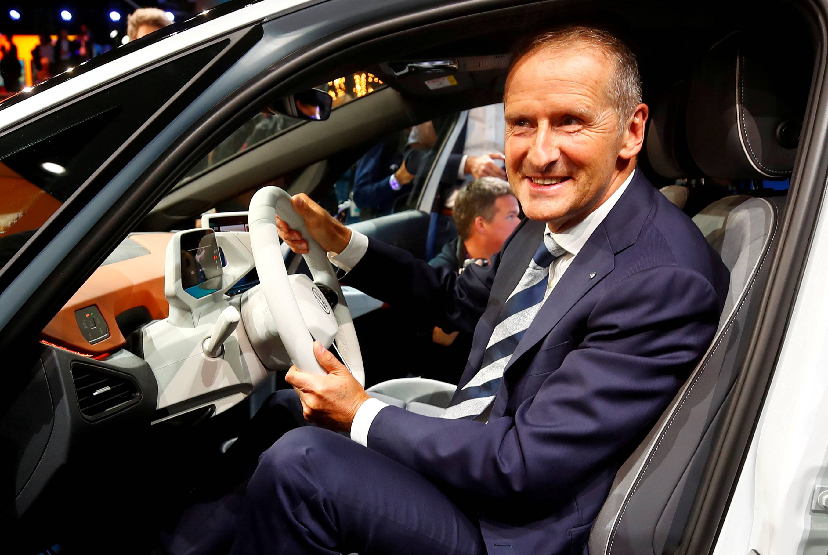 Herbert Diess, CEO of German carmaker Volkswagen AG, poses in an ID.3 prototype on the eve of the International Frankfurt Motor Show in 2019. | Reuters 