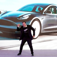 Tesla Inc. CEO Elon Musk dances onstage during a delivery event for Tesla\'s China-made Model 3 cars in Shanghai in January 2020.  | REUTERS 