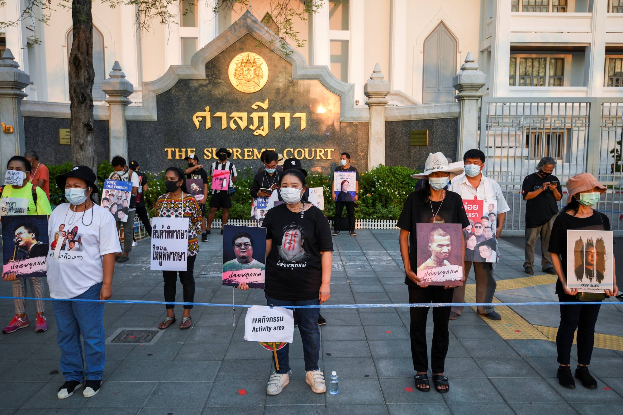 The mothers of arrested anti-government protest leaders demand the release of their sons outside Remand prison in Bangkok on April 28. | Reuters 