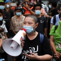 Sureerat Chiwarak attends a demonstration outside the criminal court in Bangkok on April 30.  | REUTERS 