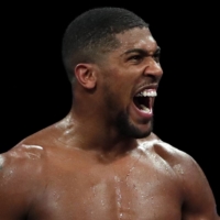 Anthony Joshua, who holds four heavyweight belts, will challenge WBC champion Tyson Fury in a unification bout later this summer according to his promoter. | REUTERS