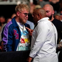 YouTuber Jake Paul (left) is confronted by UFC ringside announcer Daniel Courmier during UFC 261 on April 24 in Jacksonville, Florida. | USA TODAY / VIA REUTERS