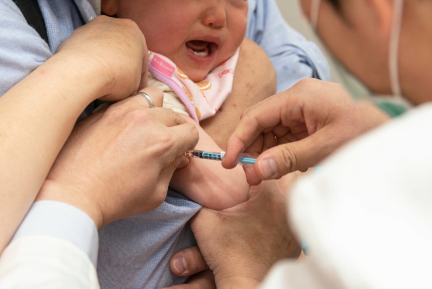 A baby has a routine vaccination at Muza Kawasaki Pediatric Clinic in Kawasaki, Kanagawa Prefecture. | ROB GILHOOLY