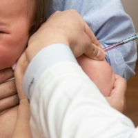 A baby has a routine vaccination at Muza Kawasaki Pediatric Clinic in Kawasaki, Kanagawa Prefecture. | ROB GILHOOLY