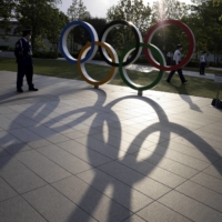 The Olympic rings outside the Japan Olympic Museum near the National Stadium, the main stadium for the Tokyo 2020 Olympic Games, in Tokyo on Sunday. | BLOOMBERG