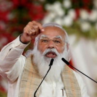 India\'s Prime Minister Narendra Modi addresses a gathering before flagging off the Dandi March, or Salt March, to celebrate the 75th anniversary of India\'s Independence, in Ahmedabad, India, on March 12. Yogi Adityanath, Uttar Pradesh’s chief minister, is increasingly mentioned as a potential successor to Modi. | REUTERS