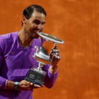 Rafael Nadal celebrates with the trophy after winning the Italian Open on Sunday in Rome. | REUTERS