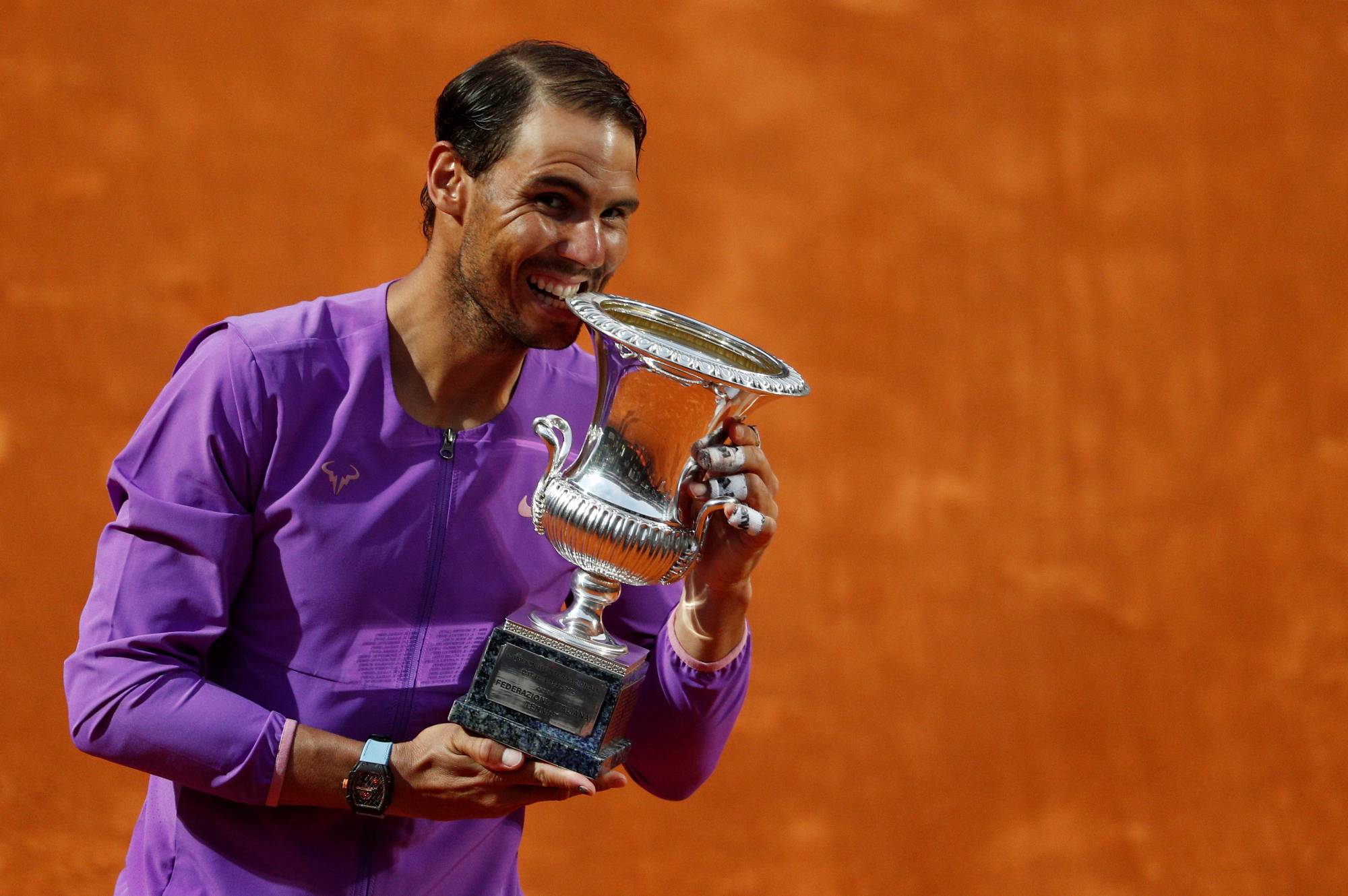 Rafael Nadal celebrates with the trophy after winning the Italian Open on Sunday in Rome. | REUTERS