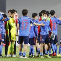Japan\'s under-24 men\'s team celebrates a win over Argentina U24 on March 29 in Kitakyushu, Fukuoka Prefecture. | KYODO