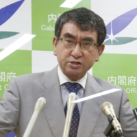 Taro Kono, the minister in charge of COVID-19 vaccinations, speaks at a news conference at the Cabinet Office in Tokyo on Tuesday. | KYODO