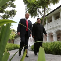 U.S. President Donald Trump and North Korea\'s leader Kim Jong Un before a working lunch during their summit in Singapore in June 2018. | REUTERS 