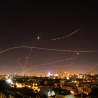 Israel\'s Iron Dome missile defense system fires to intercept rockets launched at Tel Aviv from the Gaza Strip on Sunday. | CORINNA KERN / THE NEW YORK TIMES