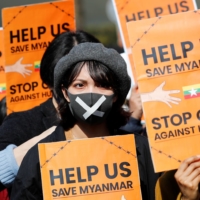 Demonstrators protest the military coup in Myanmar during a rally in central Tokyo in February.  | REUTERS 