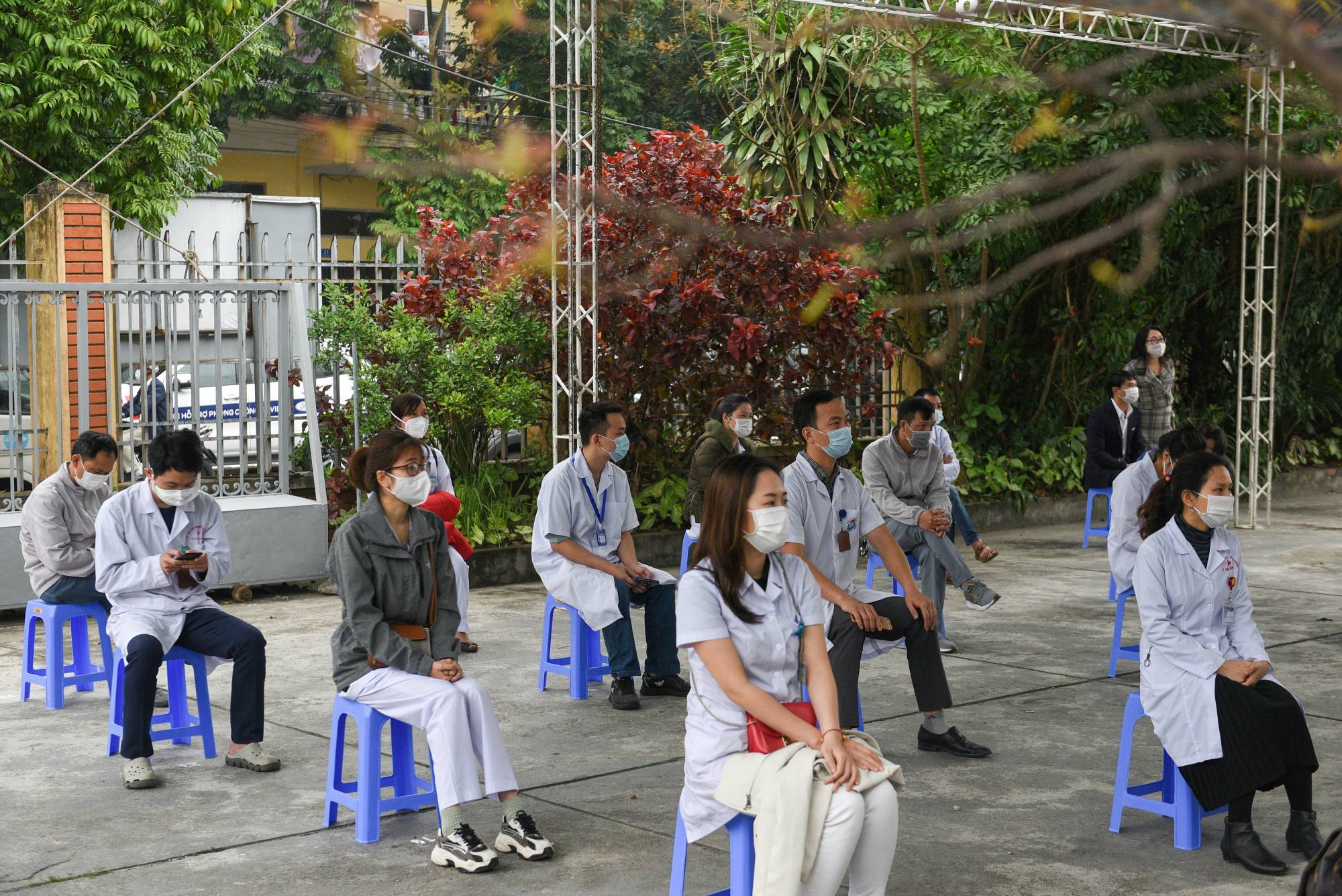 Health workers wait for COVID-19 vaccines at Hai Duong Hospital for Tropical Diseases in Hai Duong province, Vietnam, in March.  | Reuters 