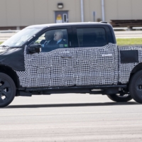 U.S. President Joe Biden drives a Ford F-150 Lightning truck at the Ford Dearborn Development Center in Dearborn, Michigan, on Tuesday. | DOUG MILLS / THE NEW YORK TIMES