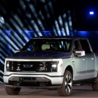 The all-electric Ford F-150 Lightning pickup truck is unveiled at the company\'s world headquarters in Dearborn, Michigan, on Wednesday.  | REUTERS 